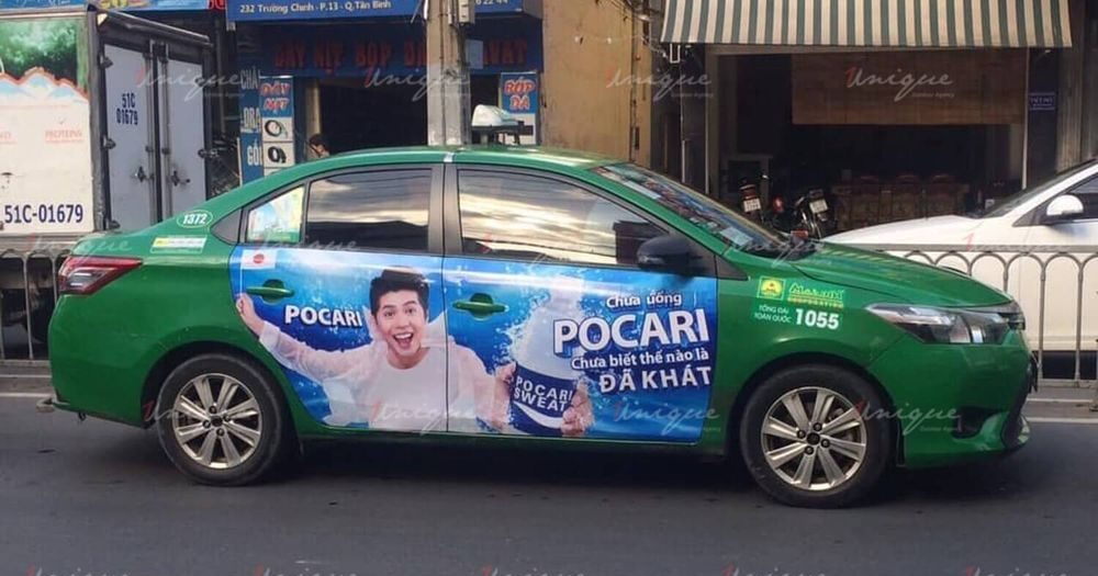 Dán quảng cáo taxi full 4 cánh cửa xe